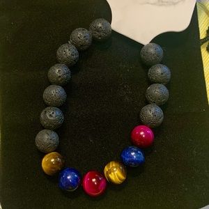 Lana’s Frozen Tears handmade bracelet, natural lava stones and tiger eye beads.